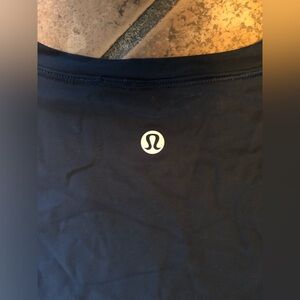 Lululemon quick pace long sleeved shirt with frilly detail in dark navy blue